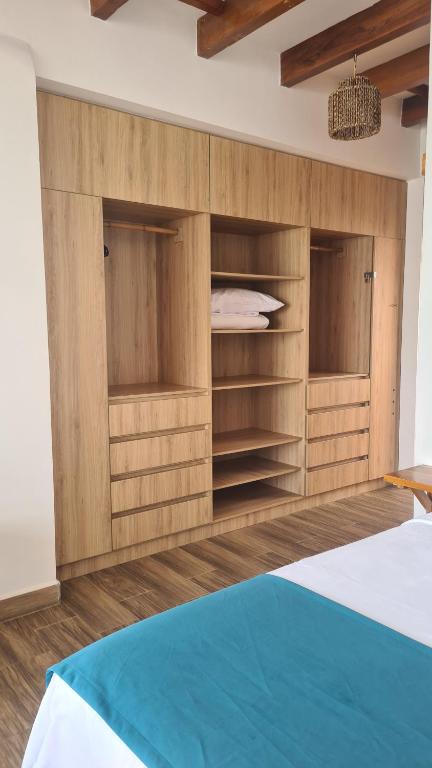 Postel nebo postele na pokoji v ubytování Intiquilla Hotel