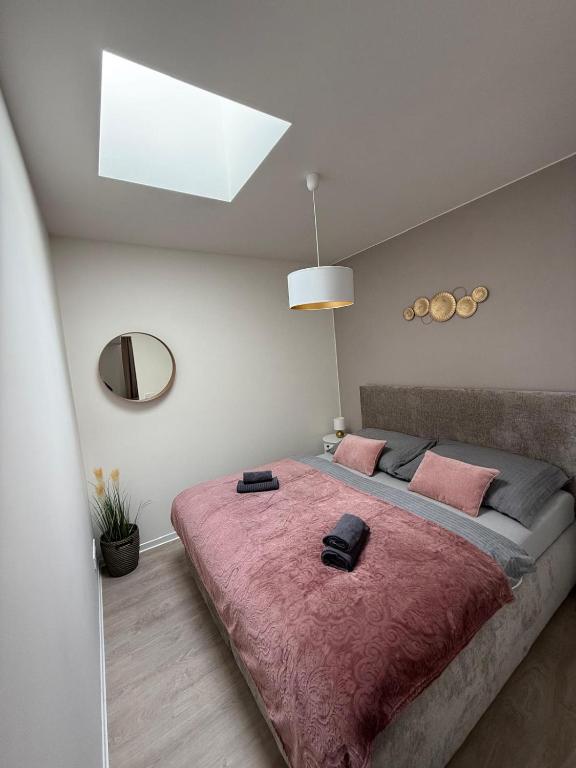 Postel nebo postele na pokoji v ubytování Apartmány U Kostela