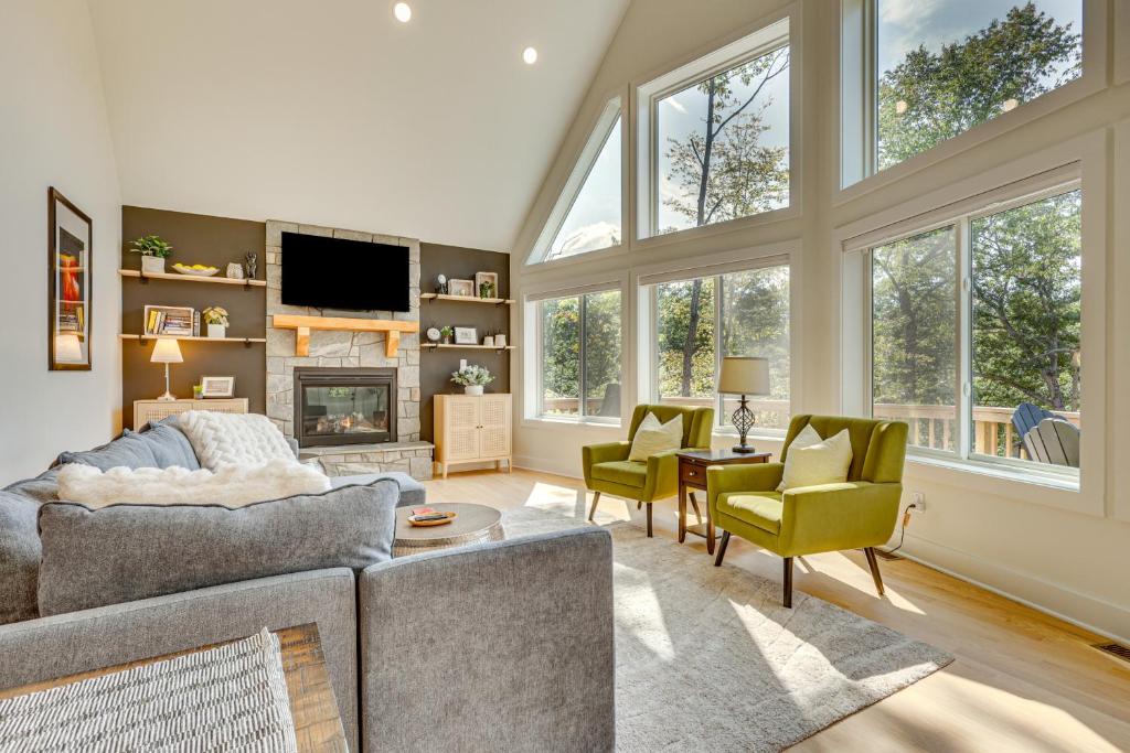 a living room with a couch and chairs and a tv at 6 Mi to Appalachian Trail Modern Front Royal Gem! in Paris