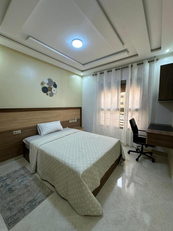 Postel nebo postele na pokoji v ubytování appartement à fes