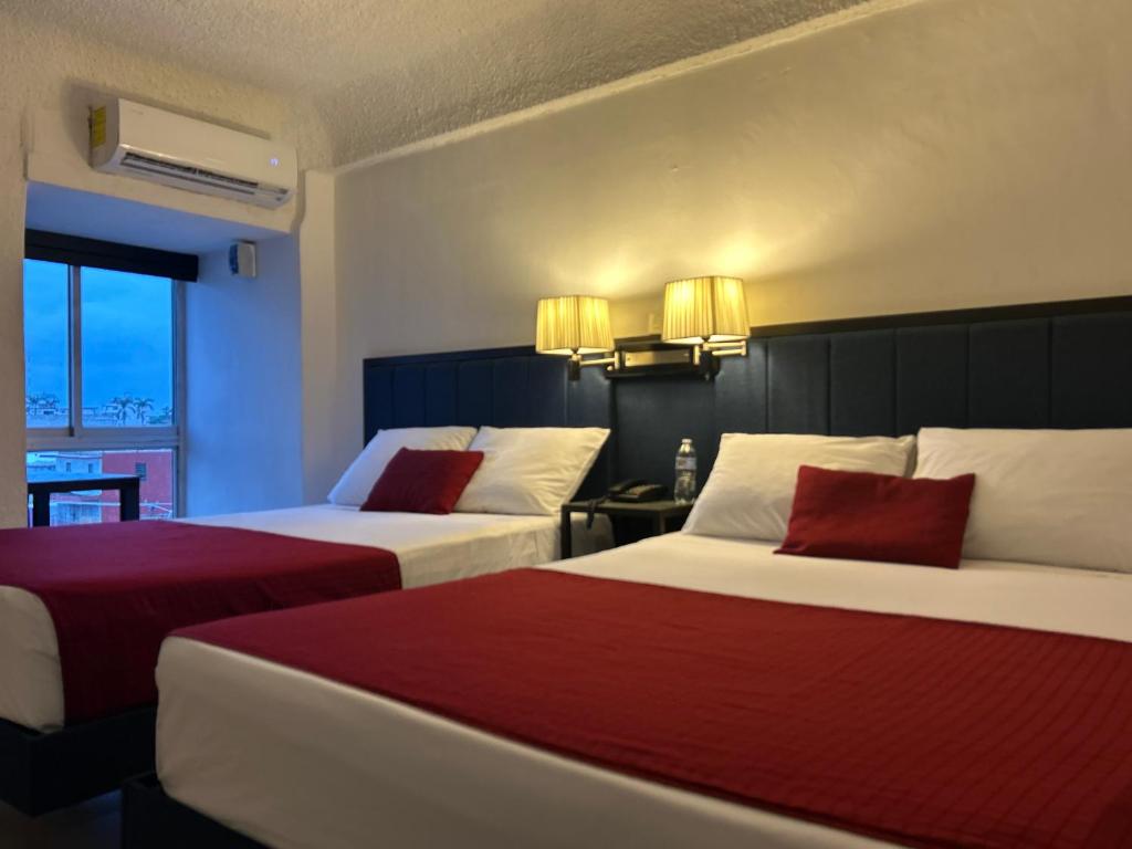 Postel nebo postele na pokoji v ubytování Choco's Hotel