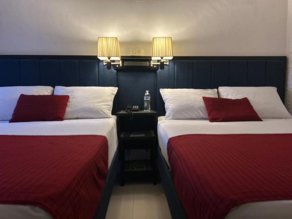 Postel nebo postele na pokoji v ubytování Choco's Hotel