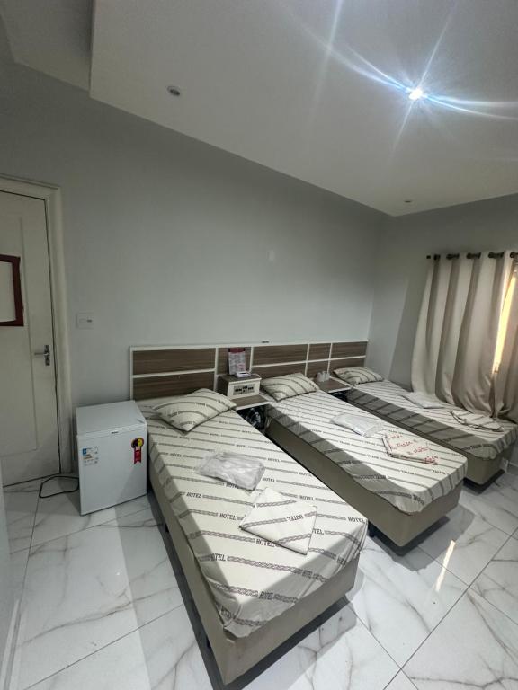 Postel nebo postele na pokoji v ubytování Hotel Maraja 9 de julho