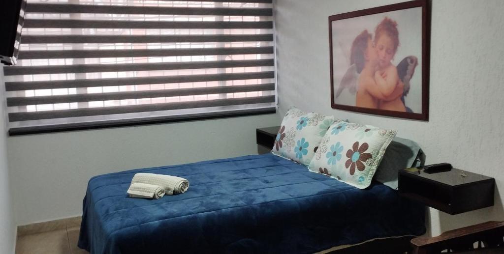 Postel nebo postele na pokoji v ubytování Habitación cerca Parque Simón Bolívar Aeropuerto Movistar Arena