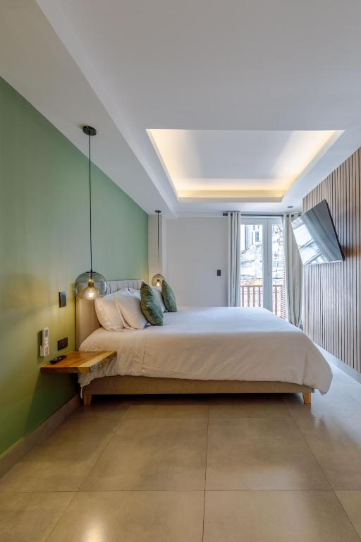 Postel nebo postele na pokoji v ubytování De la cruz Studio Apartments
