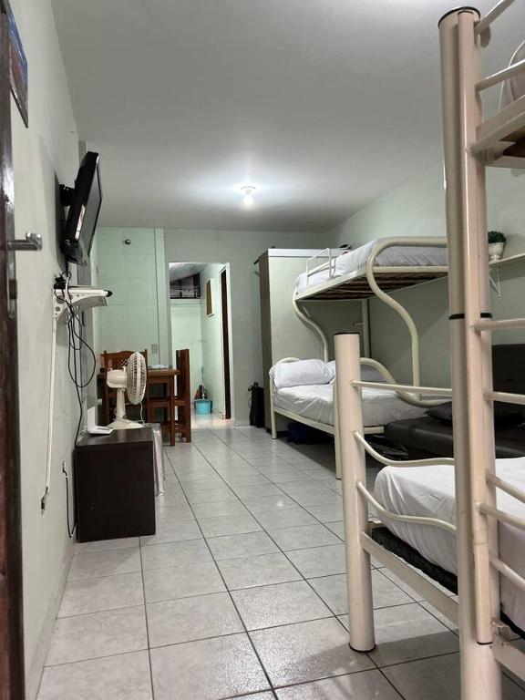 Postel nebo postele na pokoji v ubytování Kitnet Flamingo 31B