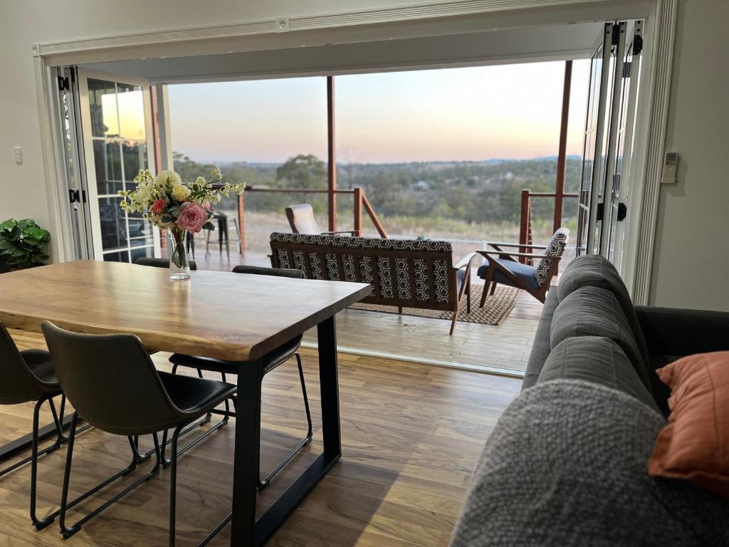 a living room with a table and a couch at Wallawa on Hilltop in Ellesmere