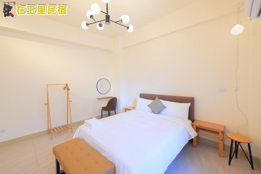 Postel nebo postele na pokoji v ubytování InYuLi Homestay花蓮縣民宿2825號