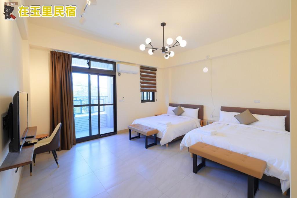 Postel nebo postele na pokoji v ubytování InYuLi Homestay花蓮縣民宿2825號