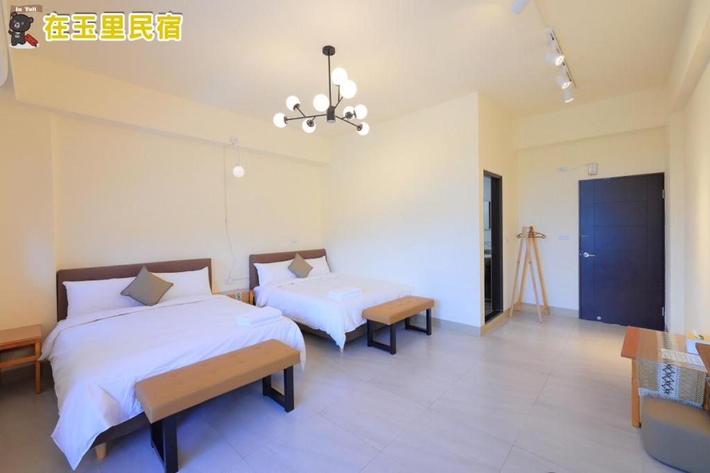 Postel nebo postele na pokoji v ubytování InYuLi Homestay花蓮縣民宿2825號