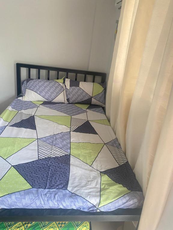 Postel nebo postele na pokoji v ubytování Restfull Transient Inn