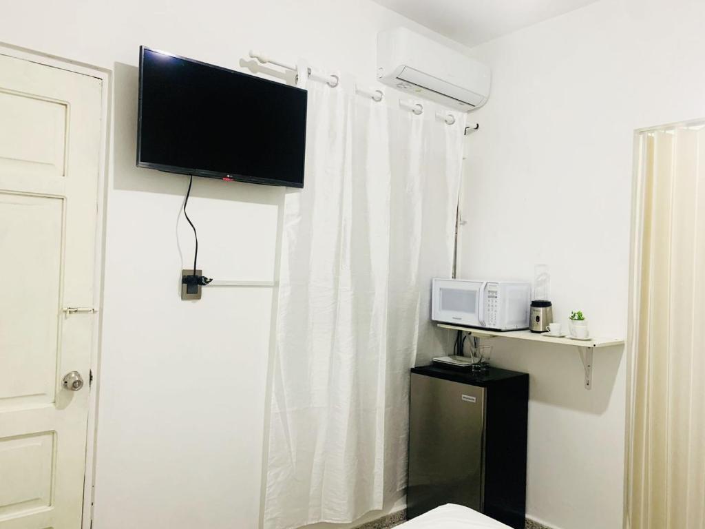 TV a/nebo společenská místnost v ubytování Tropical Estudio En El Centro De La Ciudad