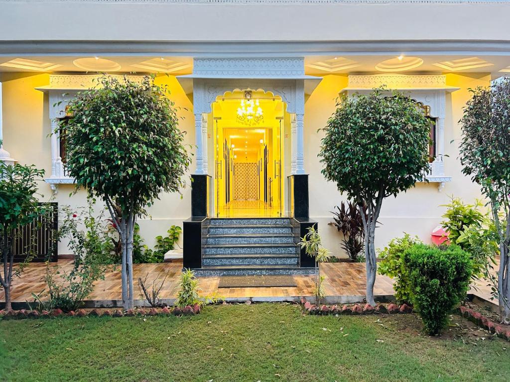 a yellow door on the front of a house at Ranthambhore Tiger Niwas in Sawāi Mādhopur