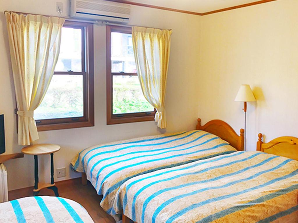 Postel nebo postele na pokoji v ubytování Pension Come