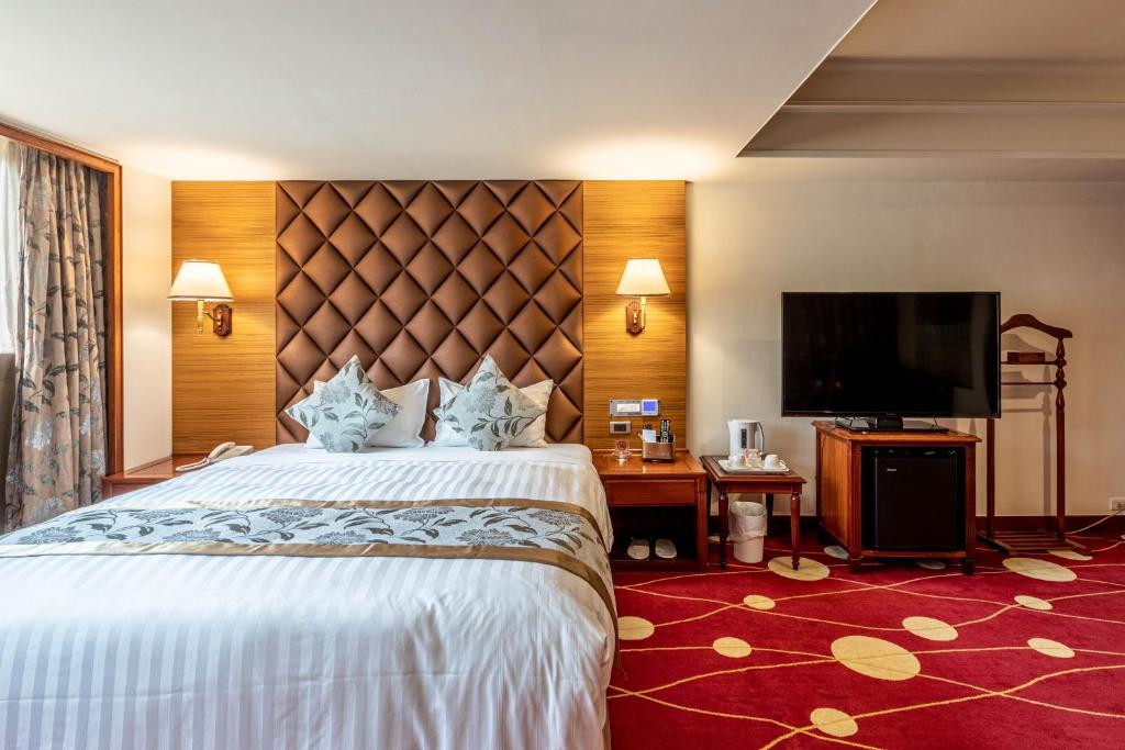 Postel nebo postele na pokoji v ubytování Chyuan Du Spring Resort