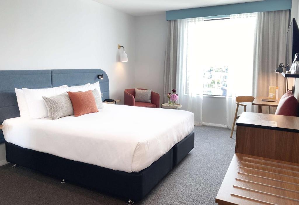 Sudima Auckland City客房内的一张或多张床位