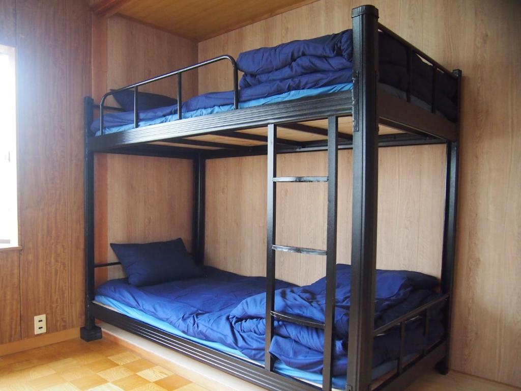 Palanda nebo palandy na pokoji v ubytování ゲストハウス柚