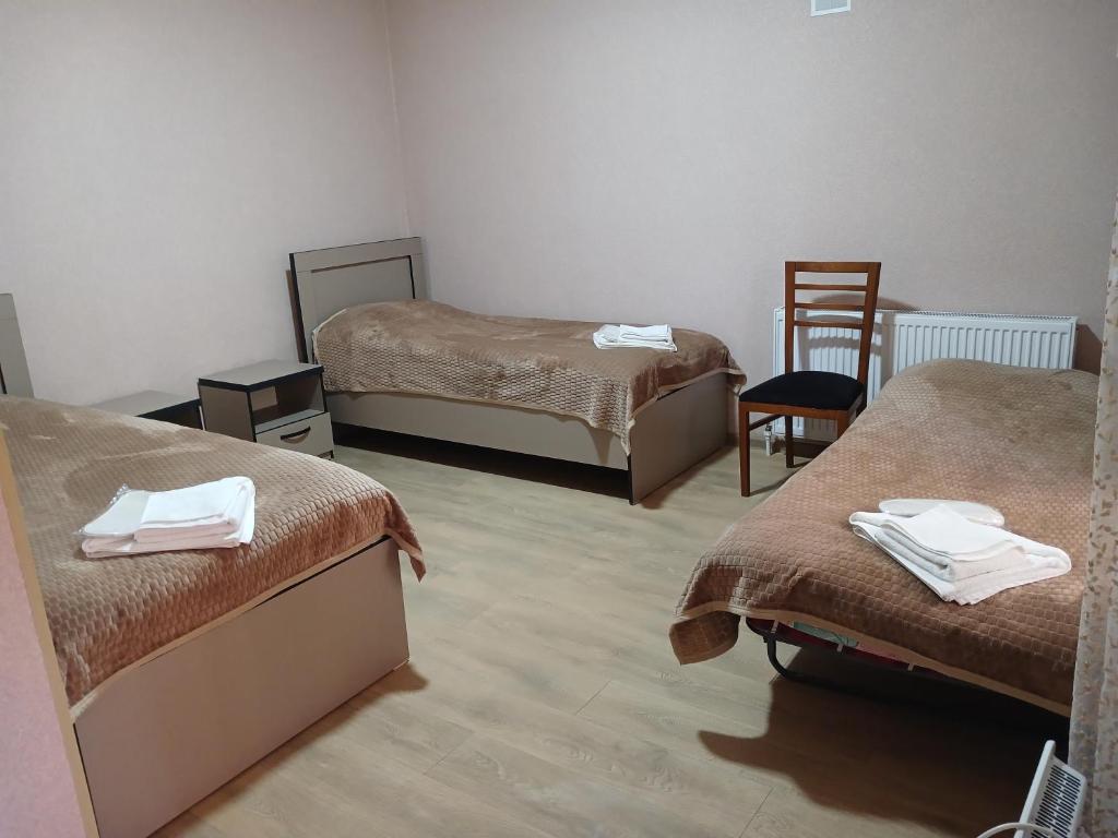 Postel nebo postele na pokoji v ubytování Vardzia Сhachkari
