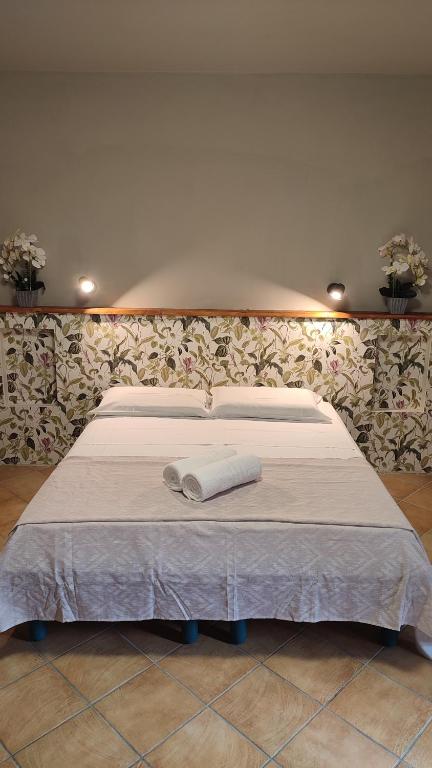 Postel nebo postele na pokoji v ubytování B&B Popoli Terme