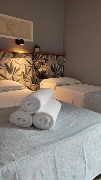 Postel nebo postele na pokoji v ubytování B&B Popoli Terme