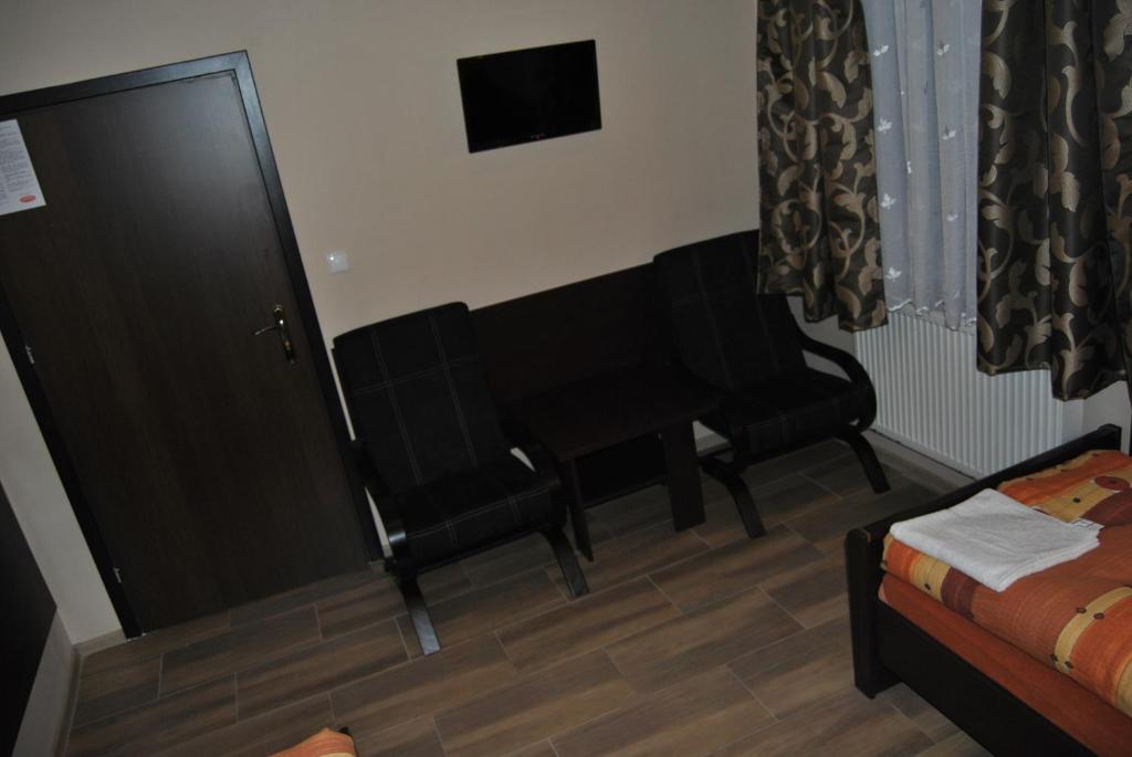 Posteľ alebo postele v izbe v ubytovaní Hotel Gościniec