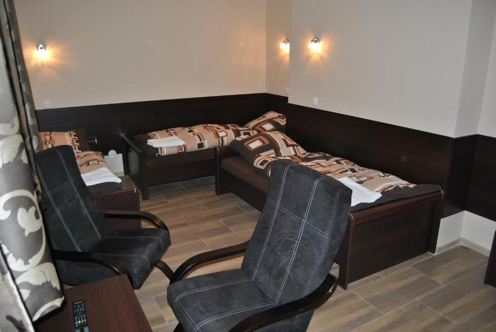 Posteľ alebo postele v izbe v ubytovaní Hotel Gościniec