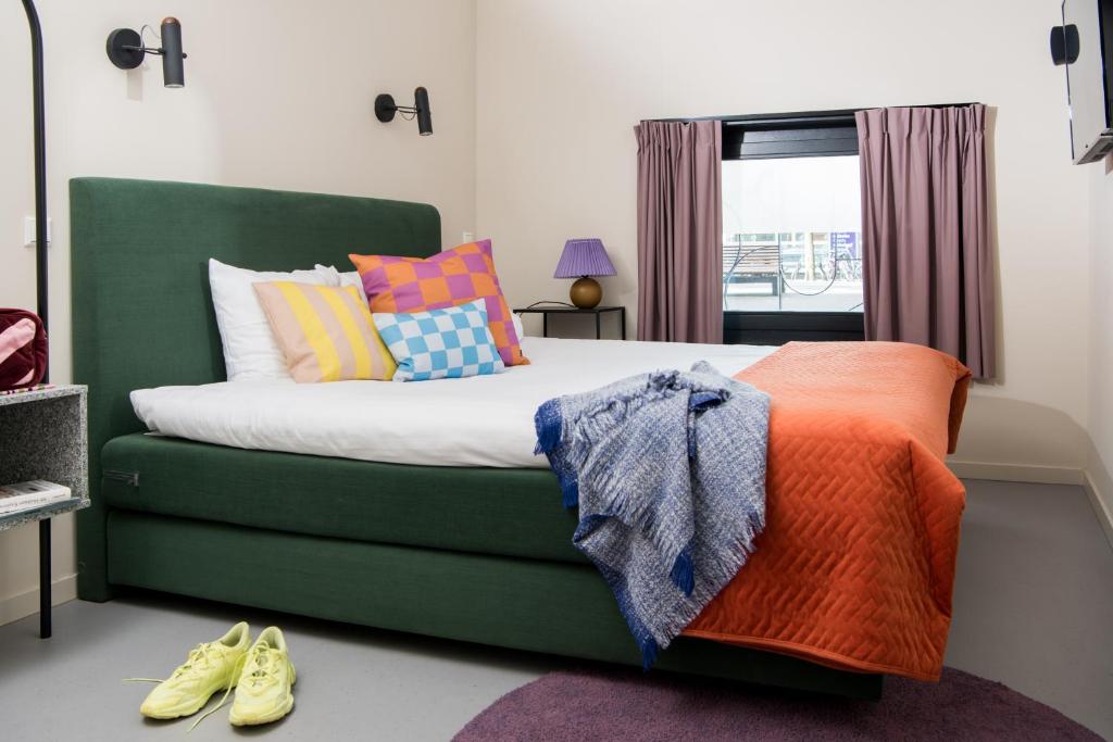 Llit o llits en una habitació de Hotel Unplugged