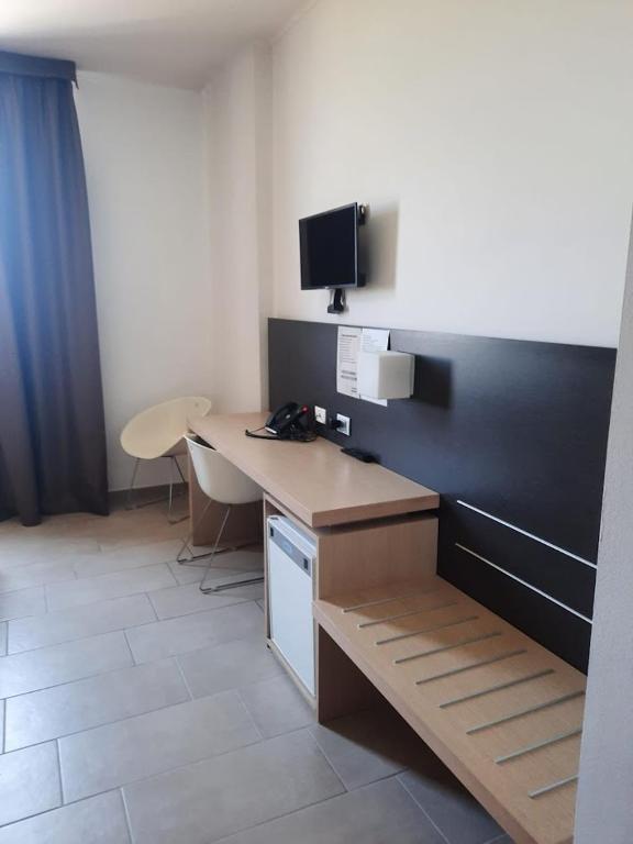 TV a/nebo společenská místnost v ubytování Hotel Verdina