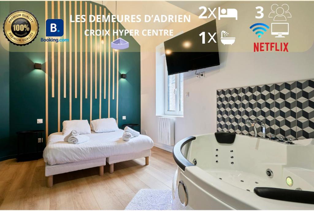 a bedroom with a tub and a bed and a tv at Stardust Croix in Croix