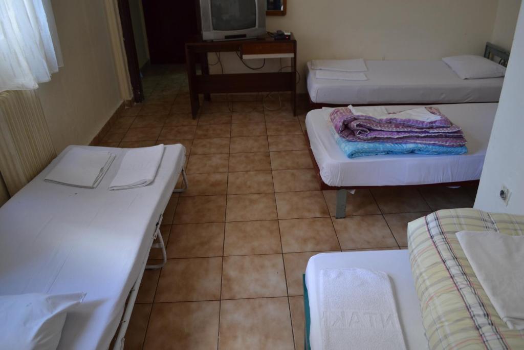 Postel nebo postele na pokoji v ubytování Argo Hotel