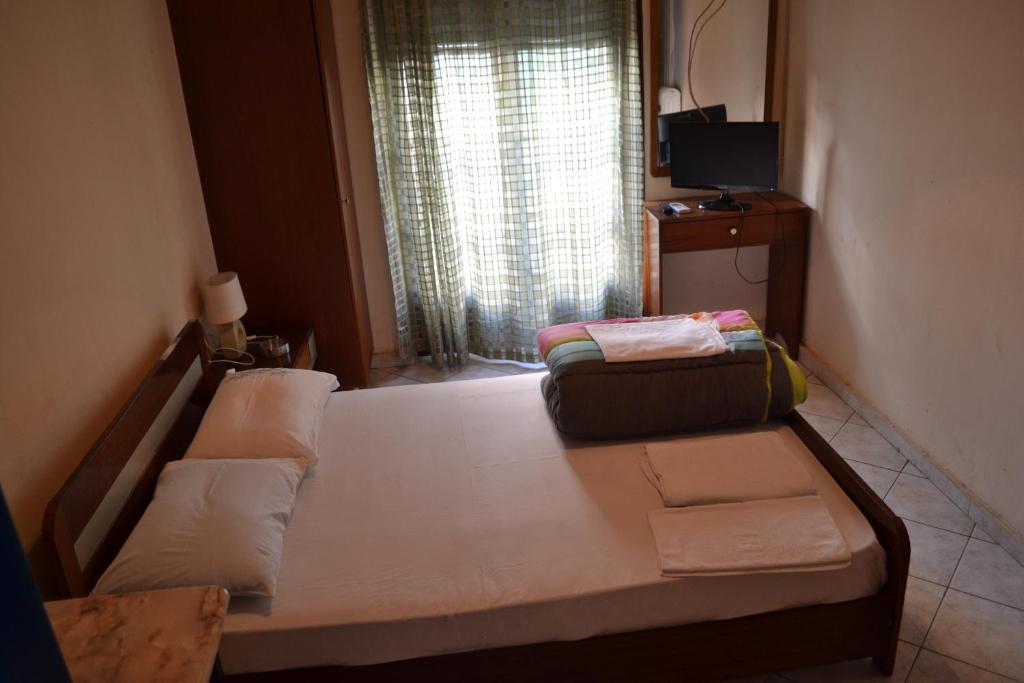 Postel nebo postele na pokoji v ubytování Argo Hotel