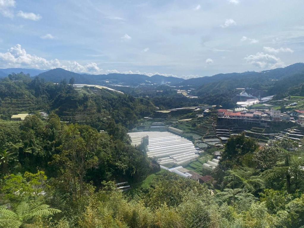 an aerial view of a river in a valley at Brinchang Cameron 2R2B 10 paxs KeaFarm #14402 in Brinchang