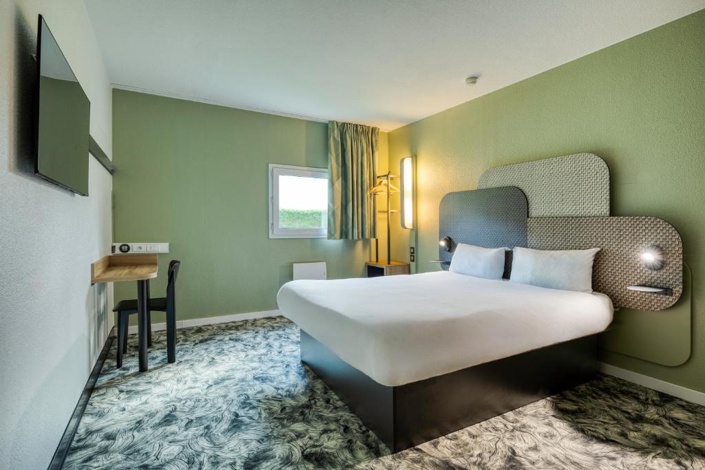Postel nebo postele na pokoji v ubytování B&B HOTEL Liège Rocourt