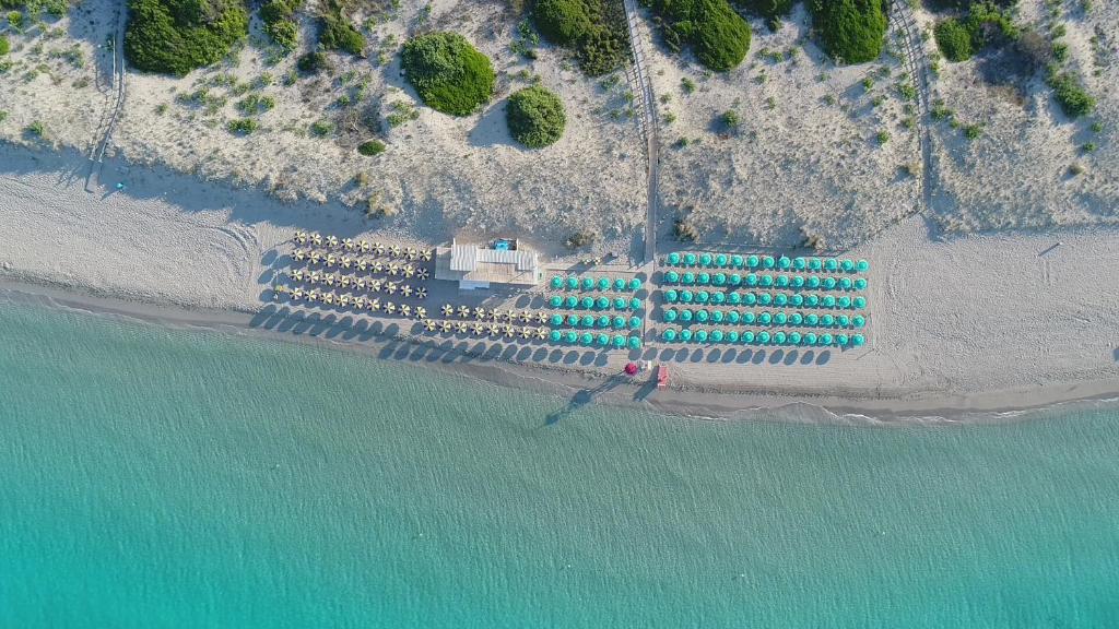 an aerial view of a beach with a group of buildings at Residence Baia D'Oro in Torre Mozza