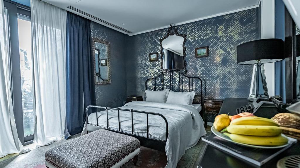 Postel nebo postele na pokoji v ubytování The Babe Boutique Hotel