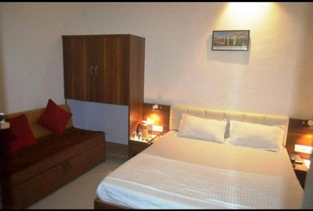 Postel nebo postele na pokoji v ubytování Hotel Chatako