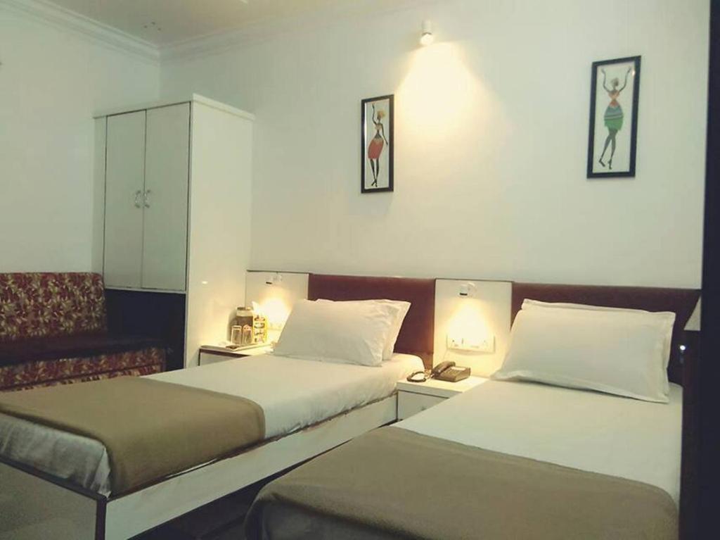 Postel nebo postele na pokoji v ubytování Hotel Chatako