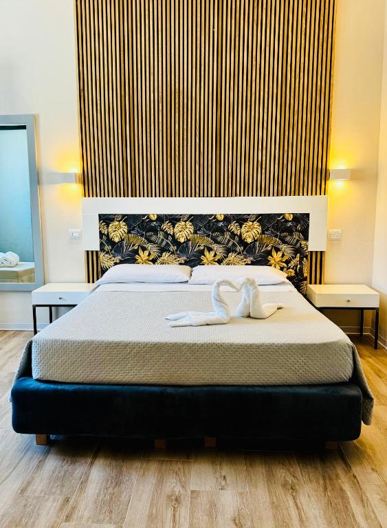 Postel nebo postele na pokoji v ubytování Hotel Lo Scoglio