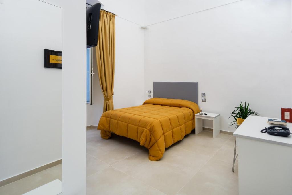 Postel nebo postele na pokoji v ubytování Il Tesoro Smart Suite & SPA