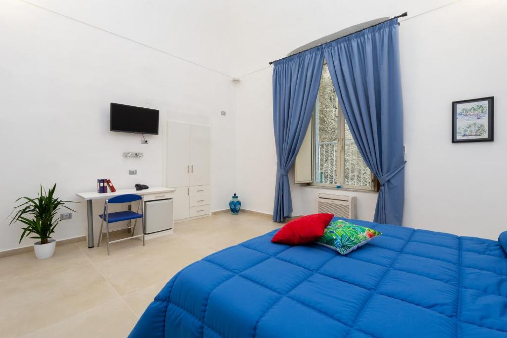 Postel nebo postele na pokoji v ubytování Il Tesoro Smart Suite & SPA