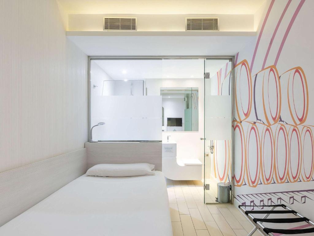 Posteľ alebo postele v izbe v ubytovaní Ibis Styles Madrid Prado