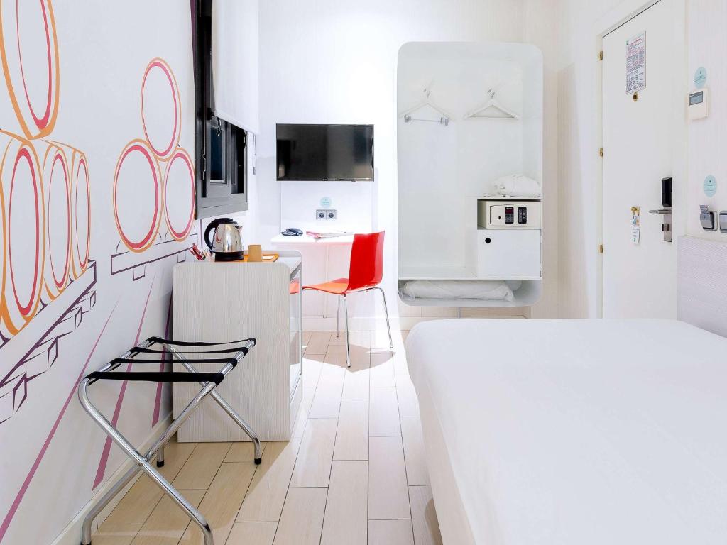 Posteľ alebo postele v izbe v ubytovaní Ibis Styles Madrid Prado