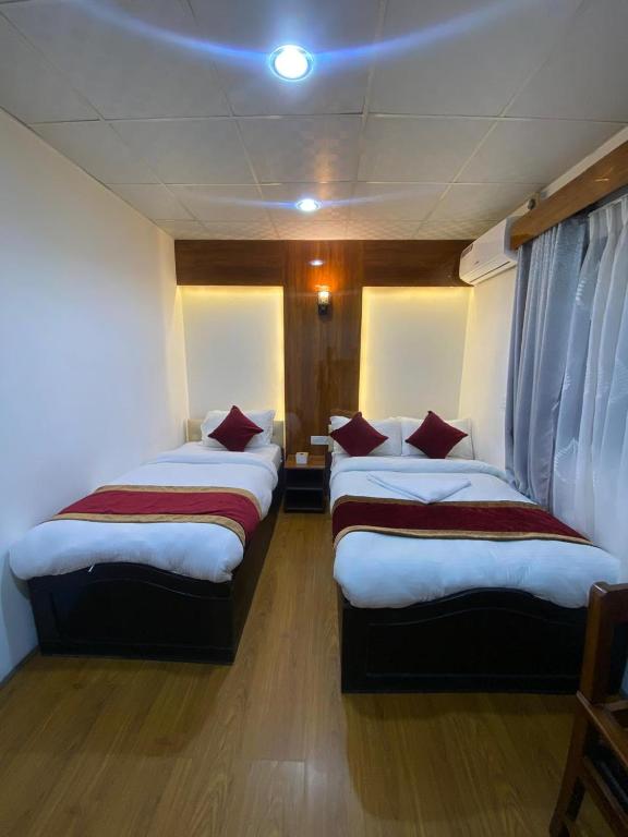 Postel nebo postele na pokoji v ubytování Thani Boutique Hotel