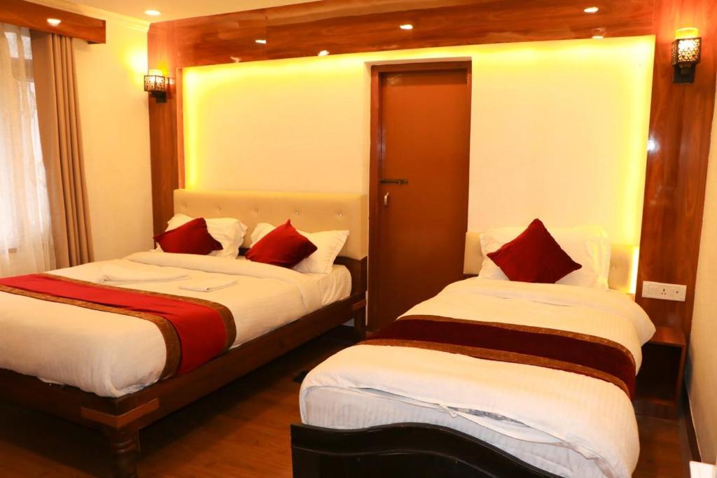 Postel nebo postele na pokoji v ubytování Thani Boutique Hotel