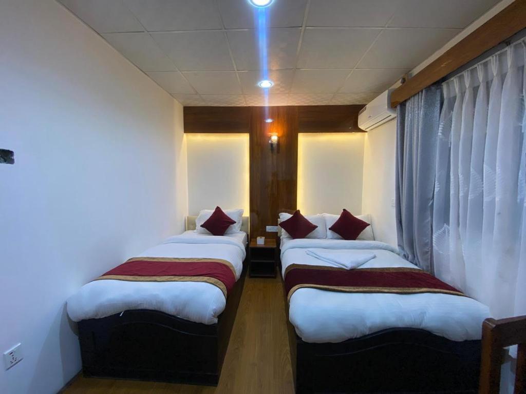 Postel nebo postele na pokoji v ubytování Thani Boutique Hotel