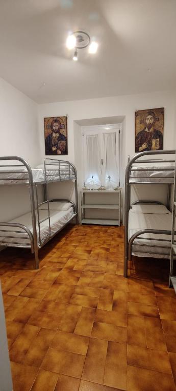 Postel nebo postele na pokoji v ubytování Locanda Maddalena - Accoglienza Pellegrini