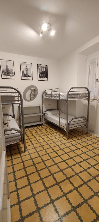 Postel nebo postele na pokoji v ubytování Locanda Maddalena - Accoglienza Pellegrini