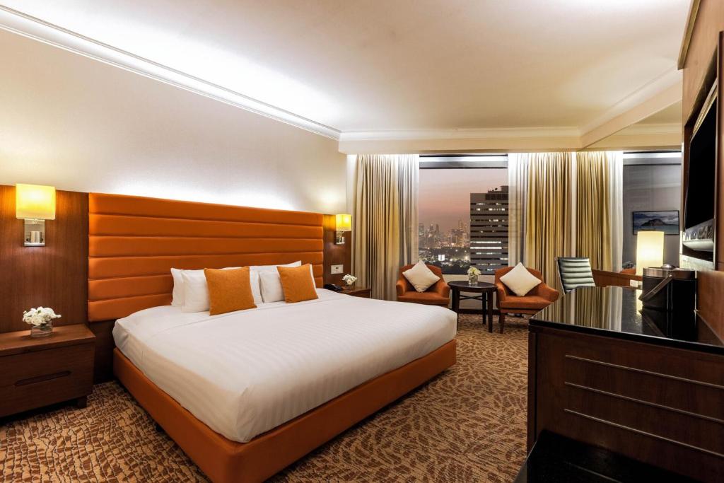 Postel nebo postele na pokoji v ubytování Rembrandt Hotel Bangkok