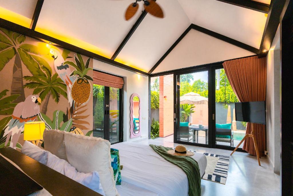 Postel nebo postele na pokoji v ubytování Tolani Resort Koh Samui