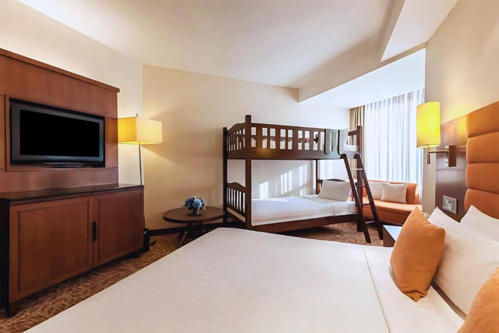 Postel nebo postele na pokoji v ubytování Rembrandt Hotel Bangkok